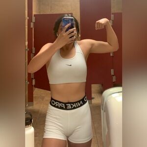 A white Nike branded sports bra and Nike shorts!